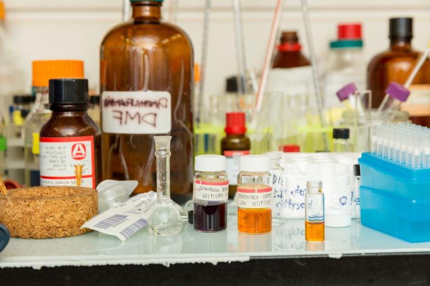 Containers of chemicals on top of a table.